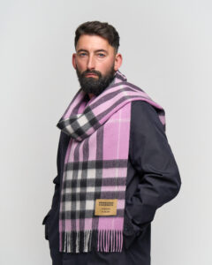 An Edinburgh Lambswool stole alongside some accessories.