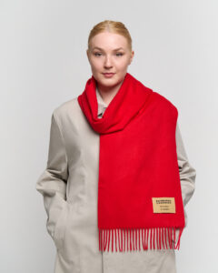 A styled gift display of cashmere scarves in boxes with ribbons, symbolising luxury and thoughtful gifting.