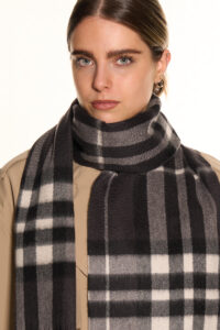 A beige cashmere scarf elegantly displayed in a premium gift box.